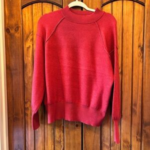 Red sweater.
